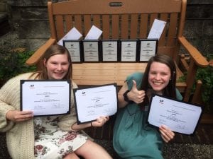 Two students with their Associated Press awards