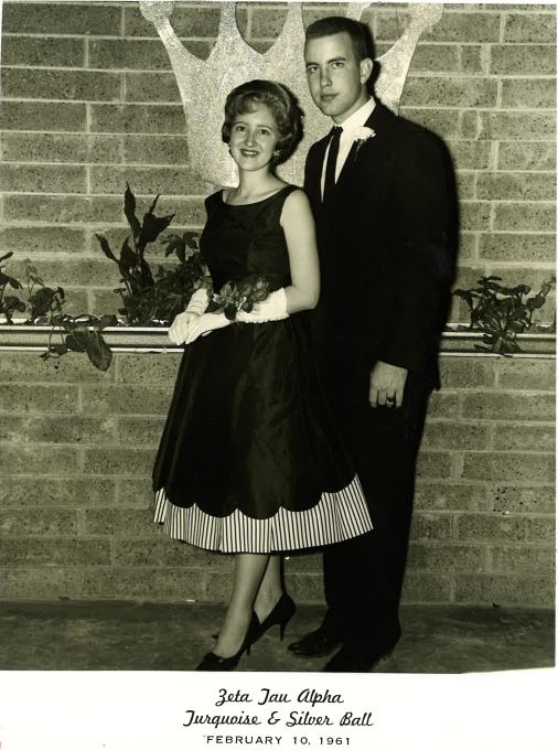 A black and white photo of Linda Higgins and her husband, Richard Higgins, in formalwear at the Zeta Tau Alpha ball in 1961.