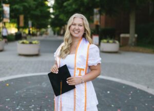 Olivia Hailey holding graduation cap