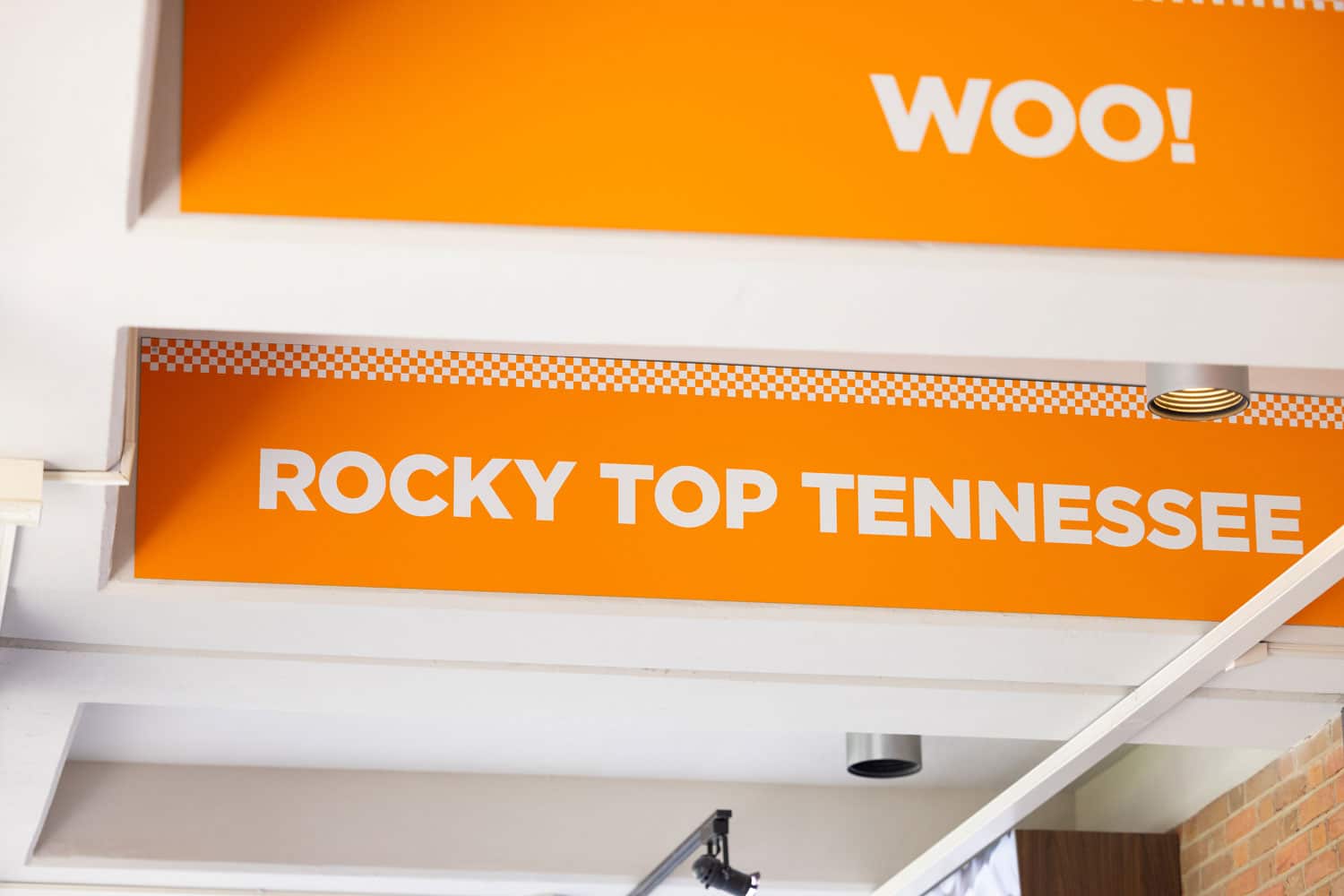 Signs on the ceiling drop downs of CCI's hallways say "Rocky Top Tennessee" and "Woo!"