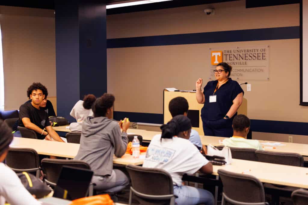 Tombras School of Advertising and Public Relations Associate Professor María De Moya teaches high school students from the Emerald Youth Foundation during their summer workshop