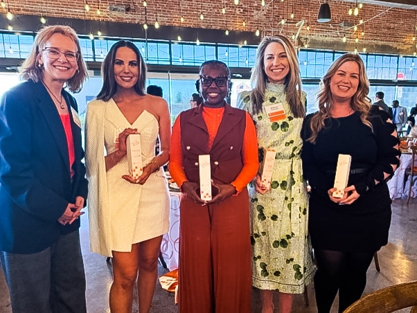 A group photo of the 2025 Volunteer 40 Under 40 cohort from the School of Journalism and Media. Honorees include alumni Amber Lynn Carroll('13), Princess Rogers ('09), Brittany Tarwater ('09, '13), and Taylor Hathorn ('14, '19).