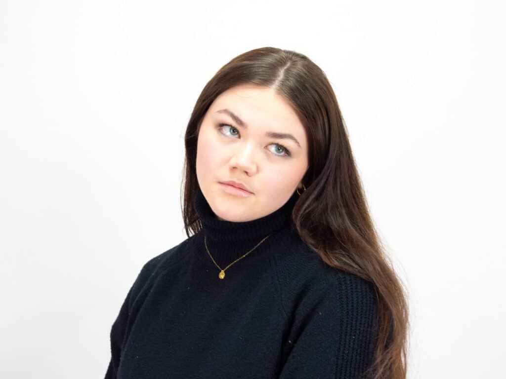 Sophia Carter's professional headshot in front of a white background