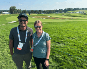 Golf Writers’ Association of America (GWAA) inaugural Herbert V. Kohler Jr./GWAA Scholarship recipients CCI doctoral candidate Aman Misra and Penn State's Amanda Vogt overlooking the famous Church Pew bunkers on Oakmont Country Club's third hole at the 2025 US Open.