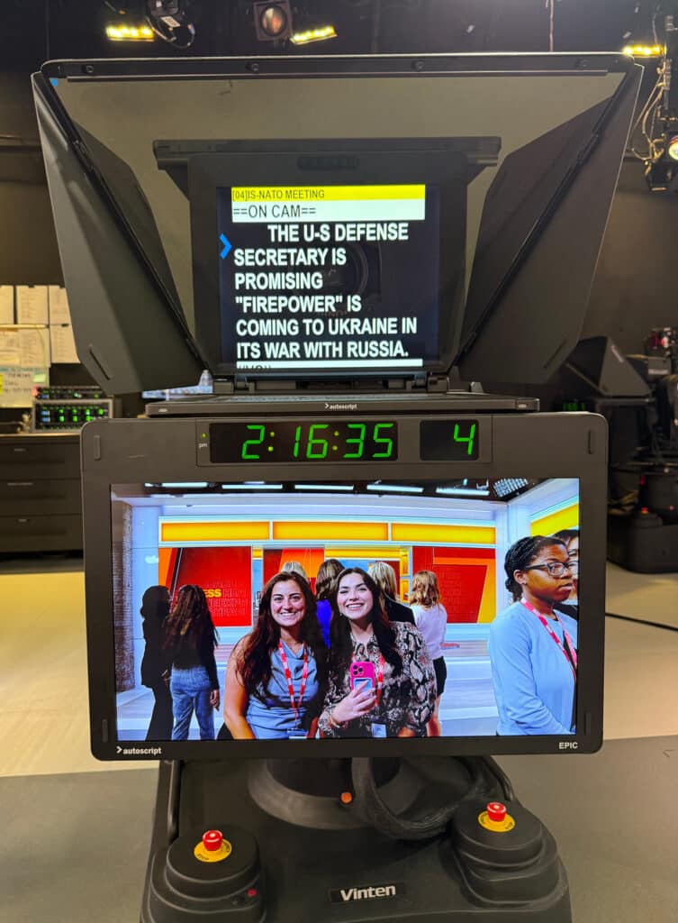 Students Gracyn Thatcher and Emma Browning can be viewed in the frame of a CNN camera viewfinder.