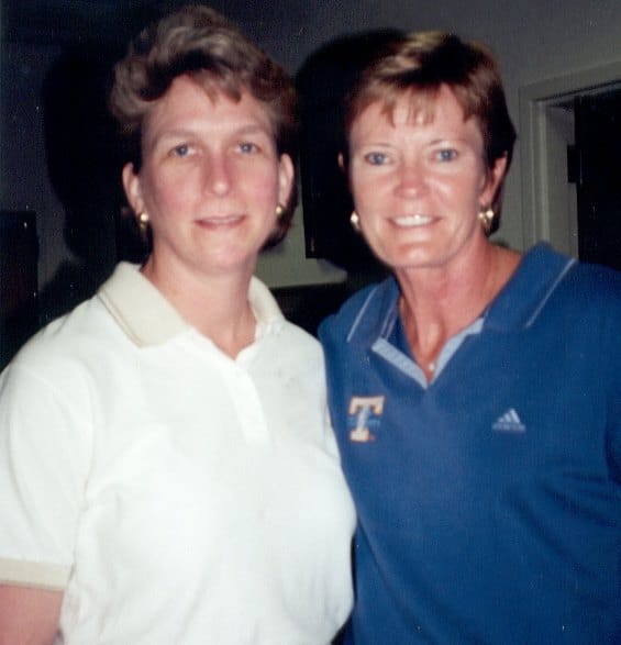 Graduating College of Communication and Information master's student wearing a white polo shirt smiles for a photo with late Tennessee Lady Volunteers basketball coach Pat Summitt, who is wearing a Lady Vols branded polo shirt, at "Spectator Camp" in 2002.