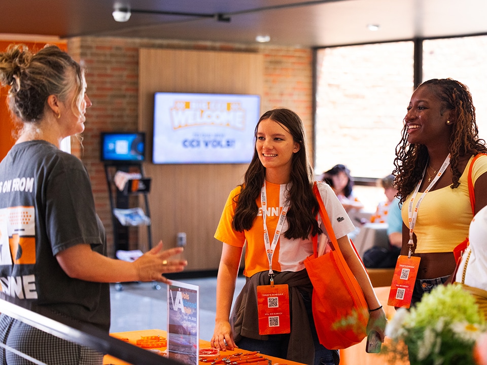 Two first year students speak to an advisor at C-C-I connect.