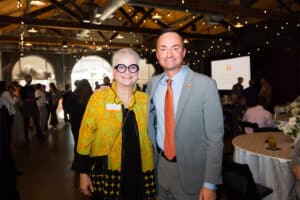 2026 Donald G. Hileman Distinguished Alumni Award winner Alisa White standing with CCI Dean Joe Mazer